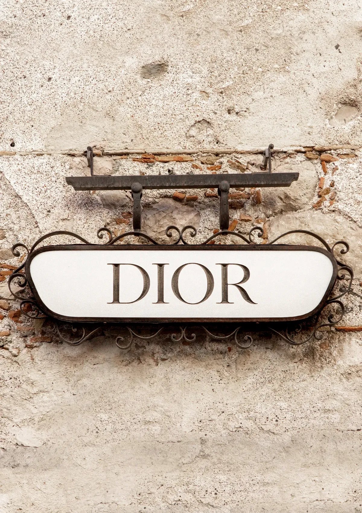 Dior sign on a textured wall