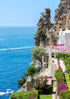 Staircase leading to a scenic coastal location with ocean view and rocky cliffs.