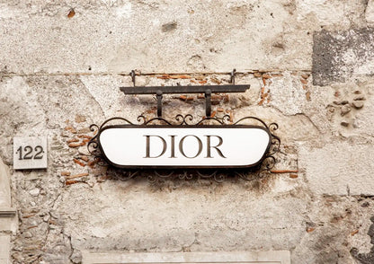 Dior sign on a textured wall