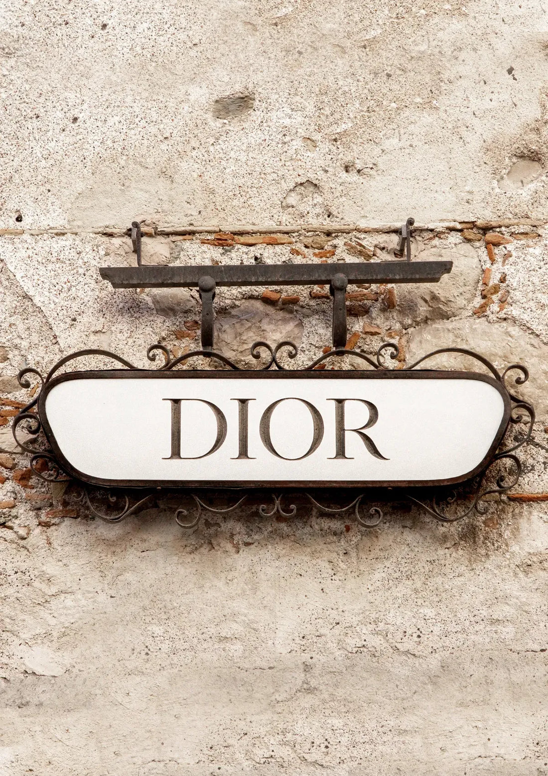 Dior sign on a textured wall