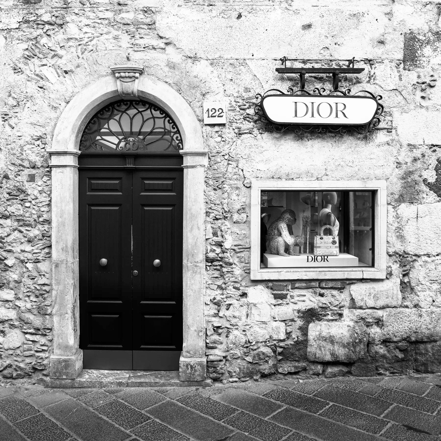 Dior store front on a stone building with &