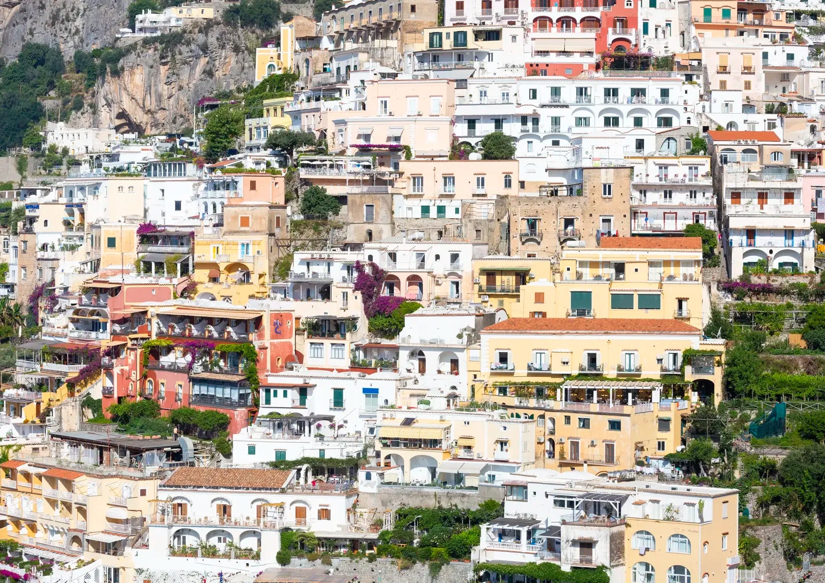 Hilly residential area with closely packed houses in a coastal town.