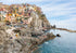 Scenic view of a coastal town with buildings on cliffs overlooking the sea.