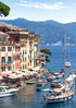 Portofino Harbour scene with boats and buildings by a mountainous landscape