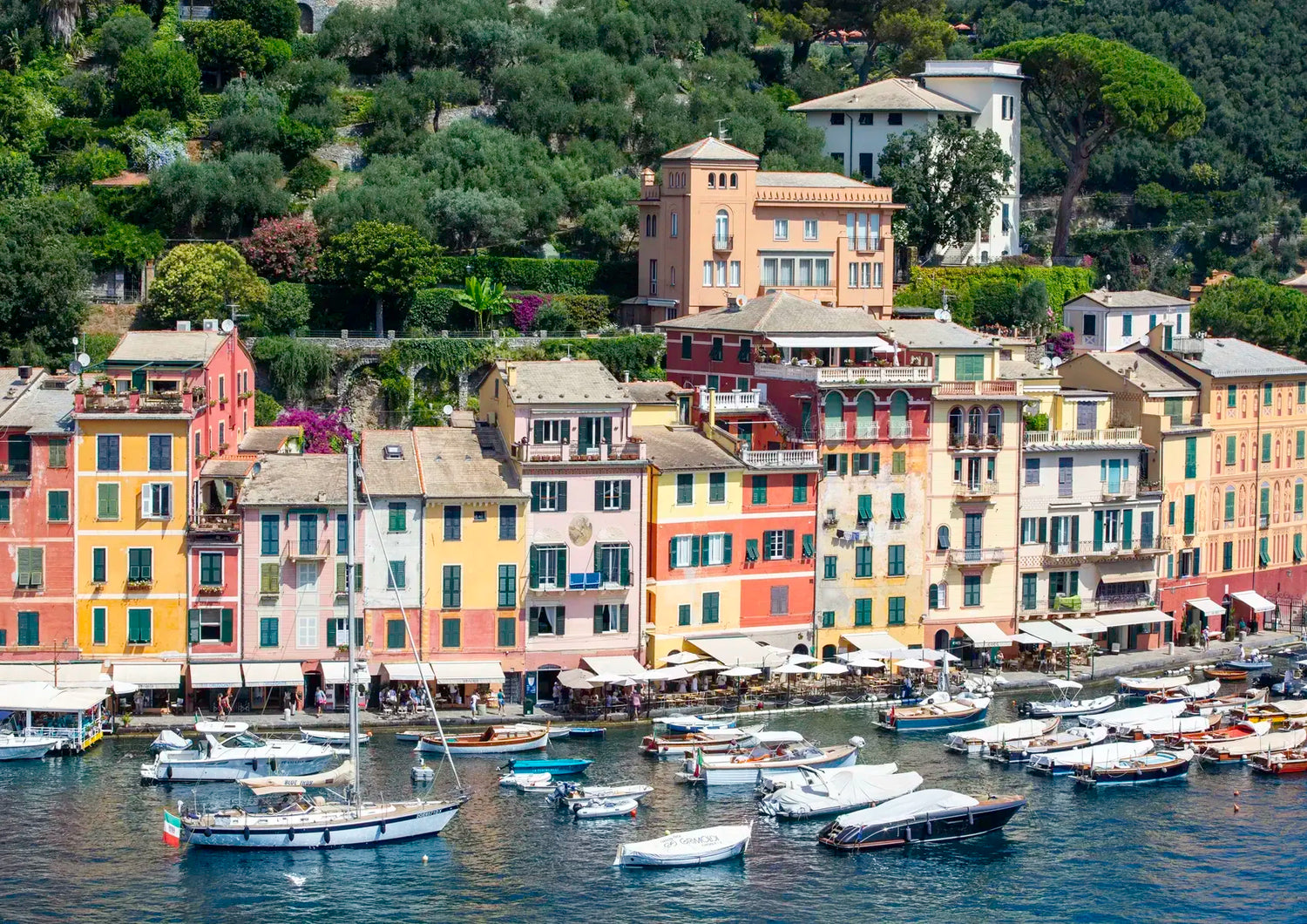 Harbour scene with boats and colorful buildings in Portofino, Italy
