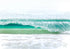 Close-up of a wave with white foam on a beach